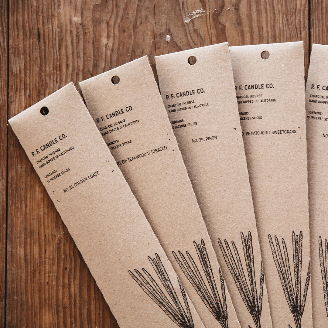 PF Candle Co's Teakwood and Tobacco packaging shot
