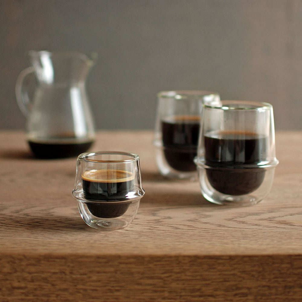 Kronos Double Walled Glass Collection from Kinto. A beautifully designed double wall glass espresso cup, with an ergonomic ring around the circumference to make the glass more comfortable to hold. The double wall enables you to handle the glass with hot liquid inside. 