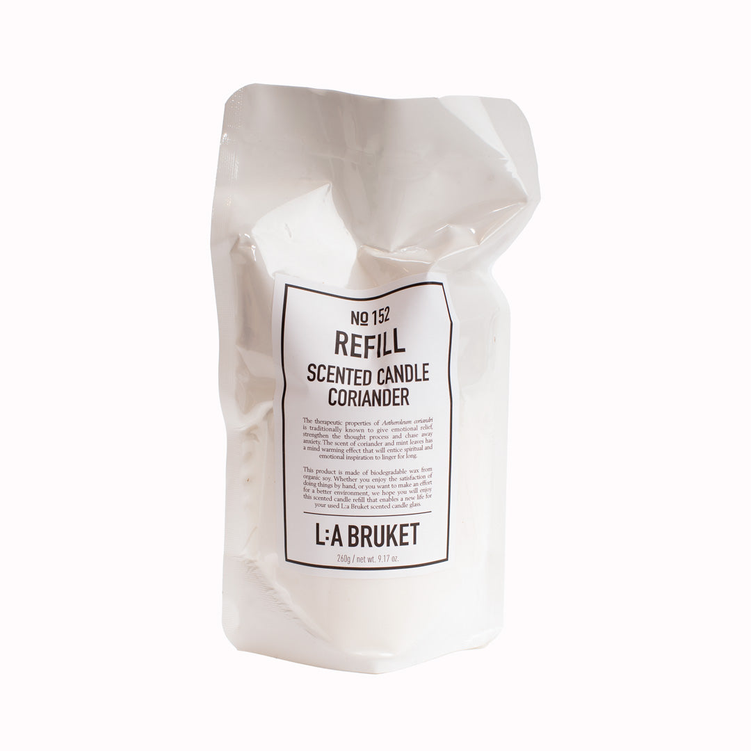Coriander | 152 | Candle Refill | 260g | L:A Bruket. Scented candle refill with a scent of fresh coriander and mint. The refill bag contains wax from organic soy, a cotton wick and wick-anchor as well as a wooden wick-holder. The readymade candle has a burn time of more than 45 hours.