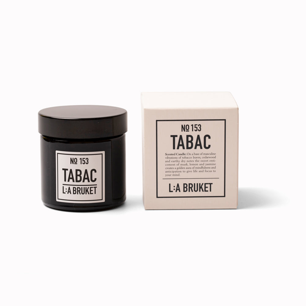 Tabac Travel Sized Scented Candle with Box from L:A Bruket. Scented travel candle from L:A Bruket, made of wax from organic soy with a burn time of more than 15 hours. The candle is filled by hand in a mouth blown tinted amber glass. A quality scented soy candle from the Swedish brand.