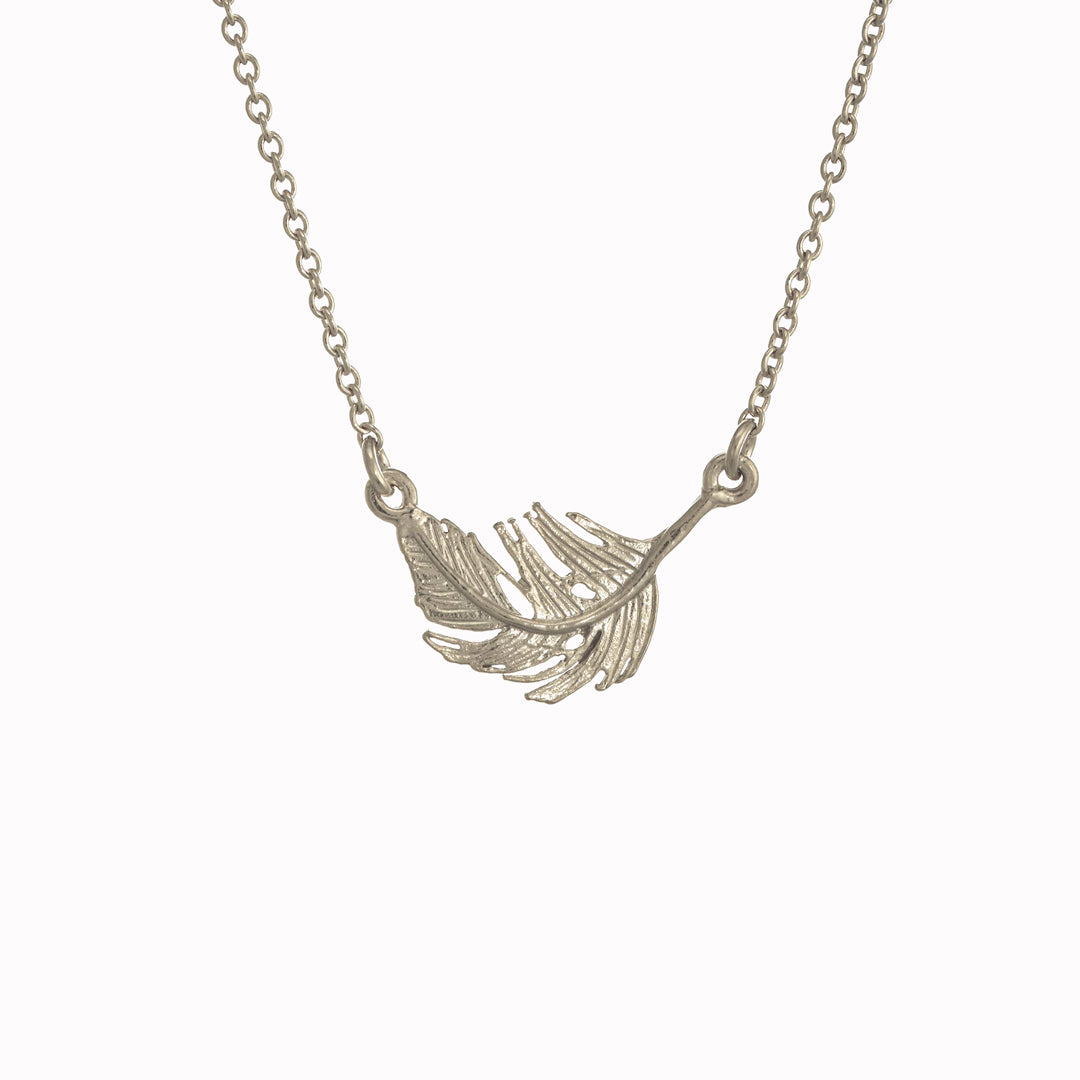 A delicately detailed floating feather in-line necklace from Alex Monroe's Classics jewellery collection.