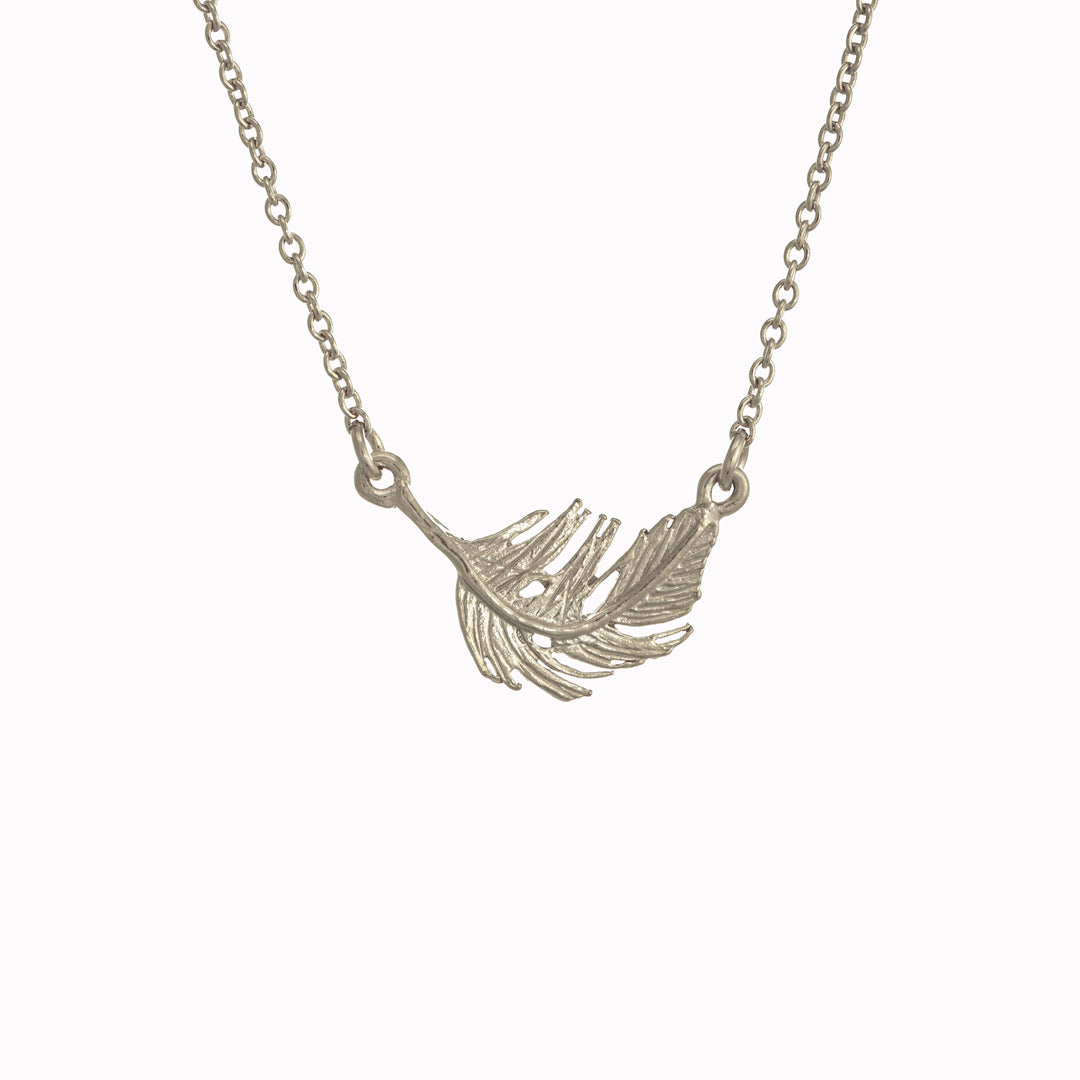 A delicately detailed floating feather in-line necklace from Alex Monroe's Classics jewellery collection.