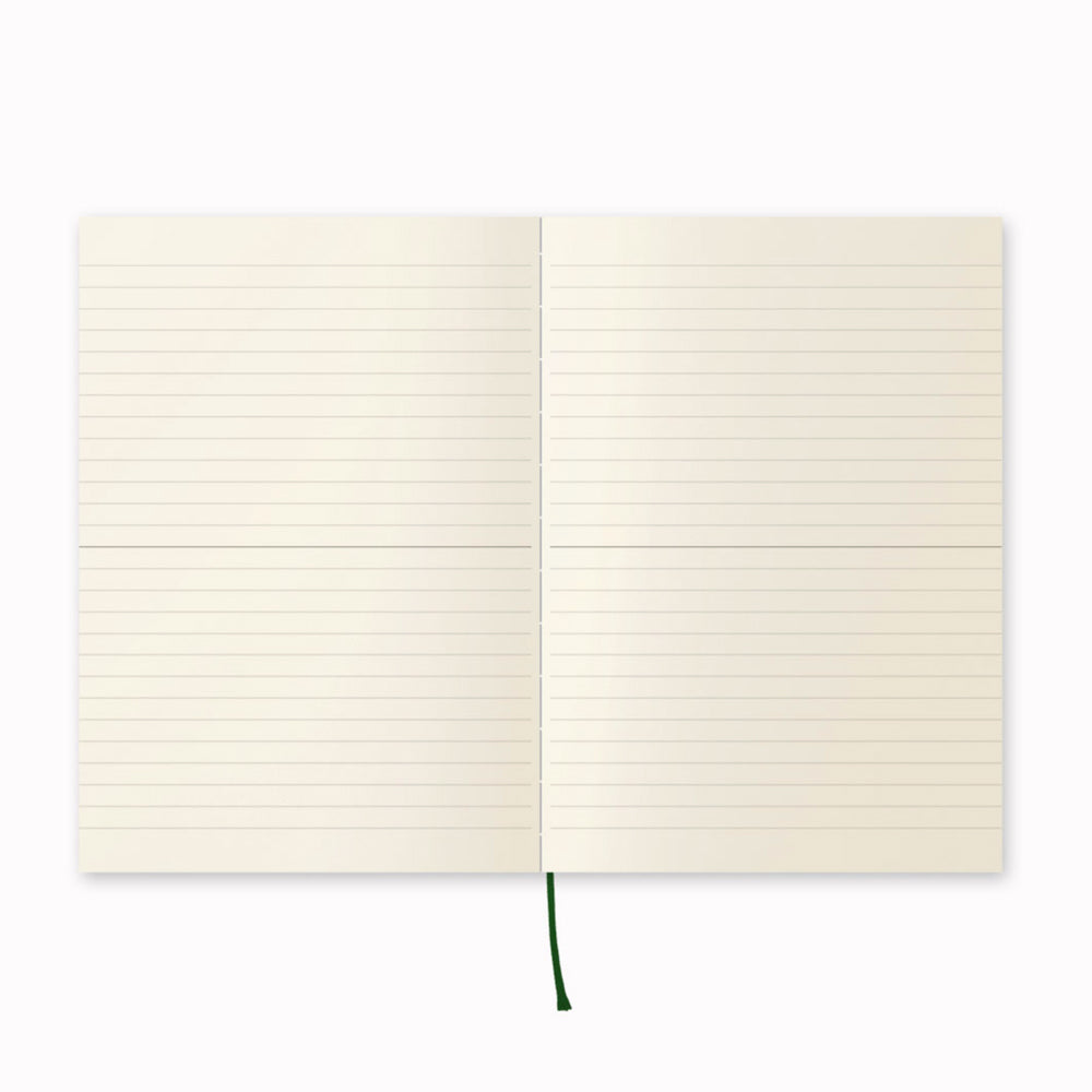 Open notebook, ruled. A5 ruled paper notebook with a simple and clean off white cover and embossed MD Paper logo. MD-Paper epitomises the subtlety, elegance and simplicity of design of good Japanese stationery, concentrating on the quality of material over branding or printed design. This 176 page notebook features a ruled layout and lay-flat binding, with a paraffin paper cover for a touch of elegance.