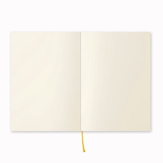 Showing notebook open flat. A5 plain paper notebook with a simple and clean off white cover and embossed MD Paper logo. MD Paper epitomises the subtlety, elegance and simplicity of design of good Japanese stationery, concentrating on the quality of material over branding or printed design. This 176 page notebook features a plain layout and lay-flat binding, with a paraffin paper cover for a touch of elegance.