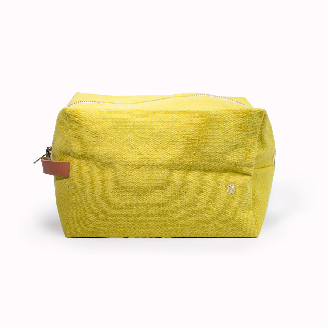 The medium Iona Cube Carry Pouch in Bergamot from French brand La Cerise sur le Gateau is a very practical and stylish travel wash or makeup bag.