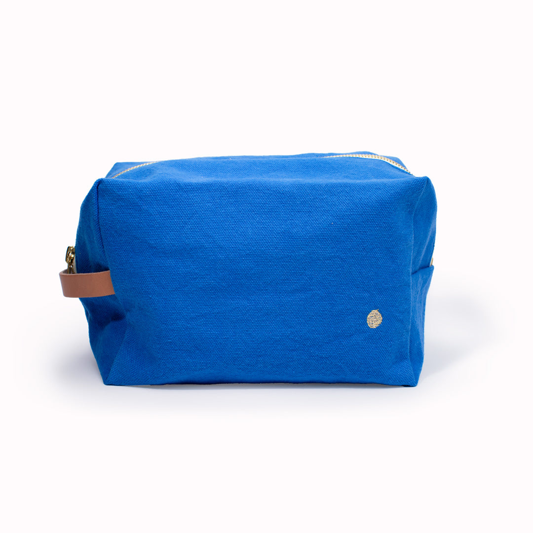 The medium ultramarine Iona Cube Carry Pouch from French brand La Cerise sur le Gateau is a very practical and stylish travel wash or makeup bag