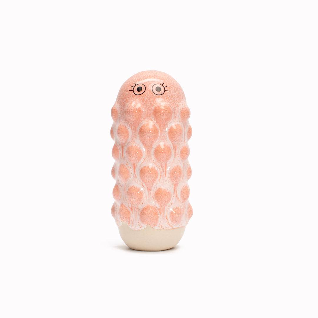 Pink Mimi, a barnacle encrusted, bobbly, hand glazed ceramic figurine created as a close relative of the classic Arhoj Ghost. 