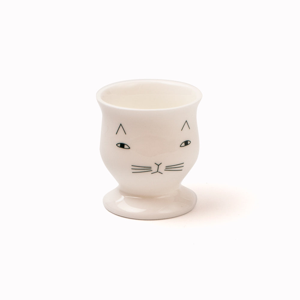 Dip your bread soldiers in the egg held by your Mog the Cat egg cup. A classic and cheerful design by Donna Wilson.  Pair with our Mog Plate and Mog Mug, or mix and match with other ceramics.