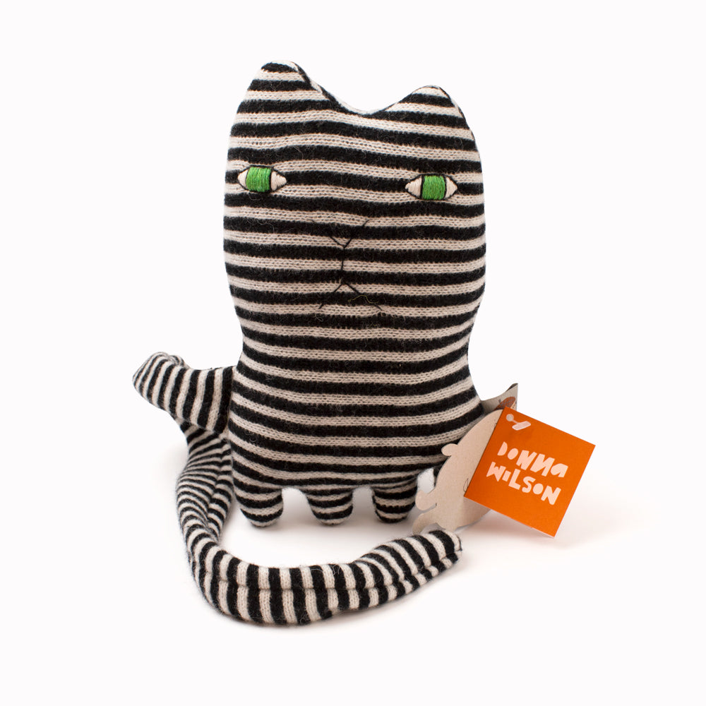 Mono Cat is the cutest and softest cuddly toy, from Donna Wilson's brilliant creatures collection. Black & White striped lambswool cat with bright green embroidered eyes and a nice soft tail.