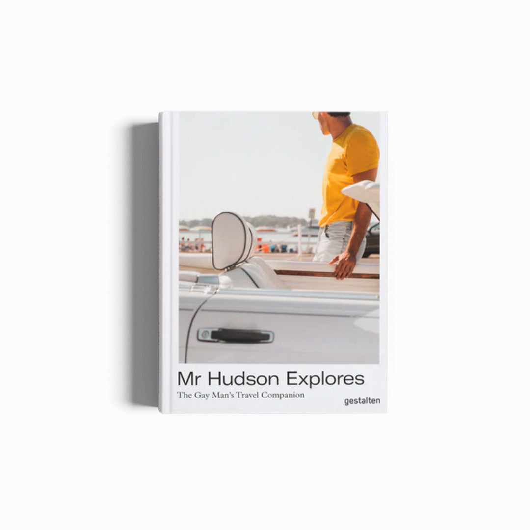 Mr Hudson Explores Travel Book, cover. This book is the ideal travel companion for the discerning gay man, and for everyone else who is keen to ensure their trips are full of incredible experiences—for those who love to explore in style.