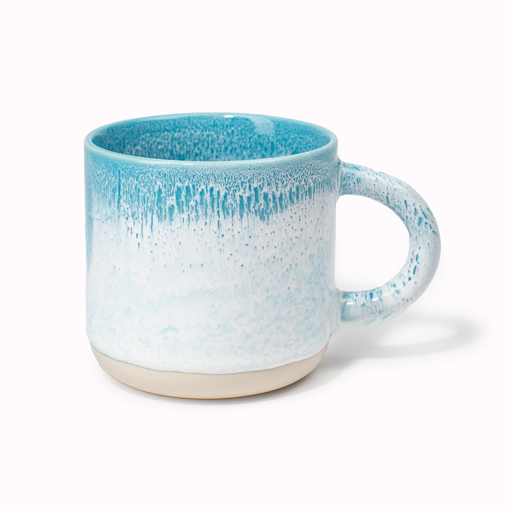 The Chug Mug by Studio Arhoj features their trademark thick, hand poured coloured glaze which means that each mug is unique. These superb mugs have a large handle and hold a good 'chuggable' serving of coffee or tea.