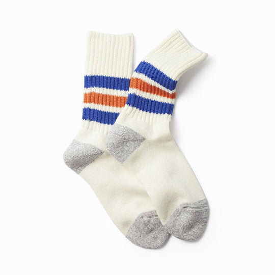 RoToTo socks are designed to provide comfort and durability for everyday wear. These premium Japanese tube sport socks are knitted on a traditional, low gauge, non computerised knitting machine. Extremely comfortable with a long pile cushioned sole, these socks are thick and luxurious. Wear with trainers (what else?) in cooler weather. White socks with blue and orange stripe around the ankle.