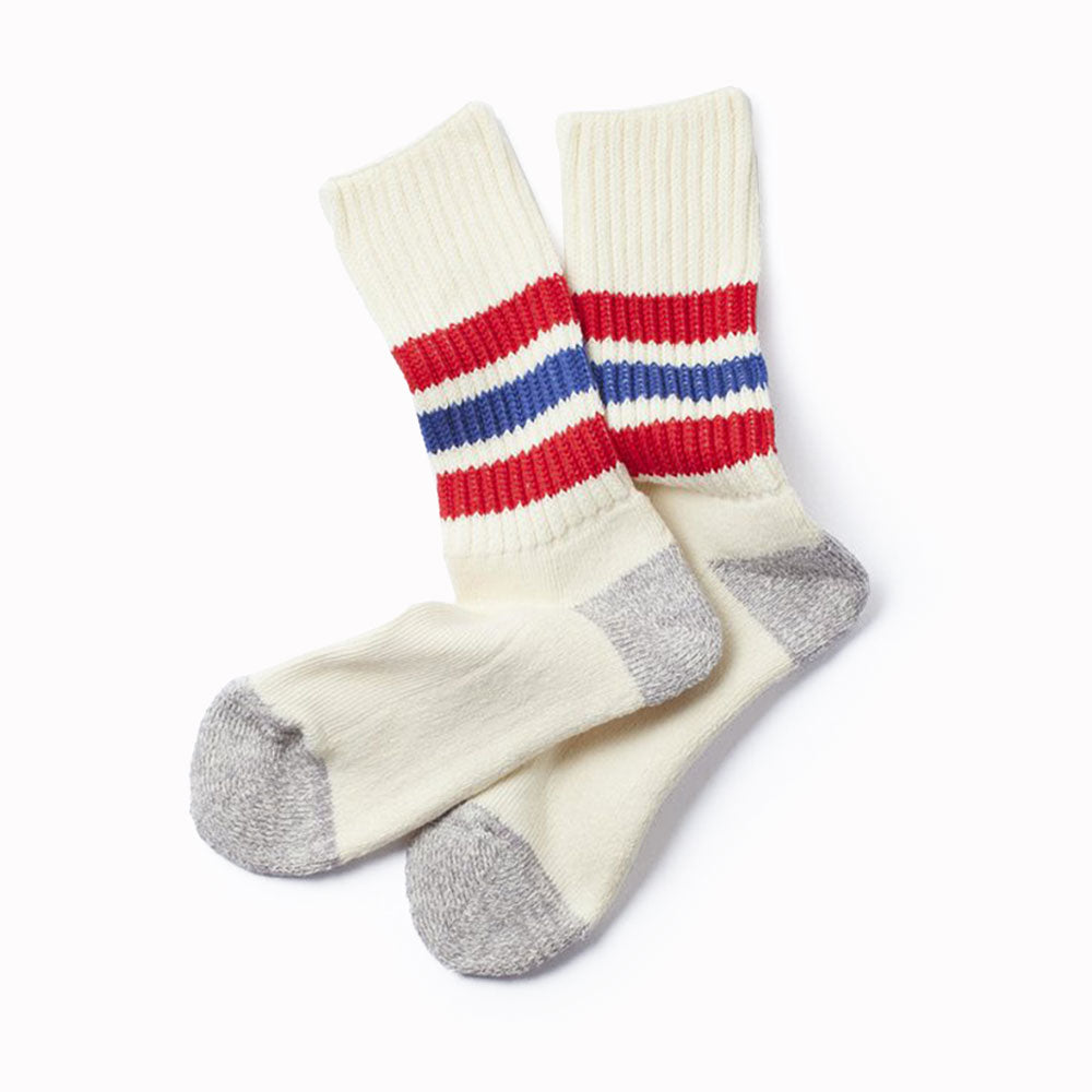 RoToTo socks are designed to provide comfort and durability for everyday wear. These premium Japanese tube sport socks are knitted on a traditional, low gauge, non computerised knitting machine. Extremely comfortable with a long pile cushioned sole, these socks are thick and luxurious. Wear with trainers (what else?) in cooler weather. White socks with red and blue stripe around the ankle.