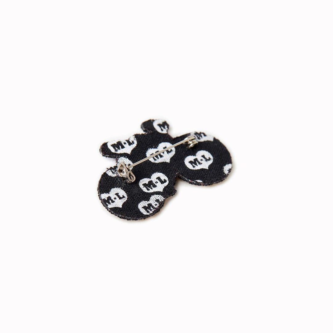 A beautiful hand-embroidered lapel pin for bike lovers everywhere. Rear view of badge, From Macon & Lesquoy, French Hand Embroidered badges and patches using Cannetille thread.