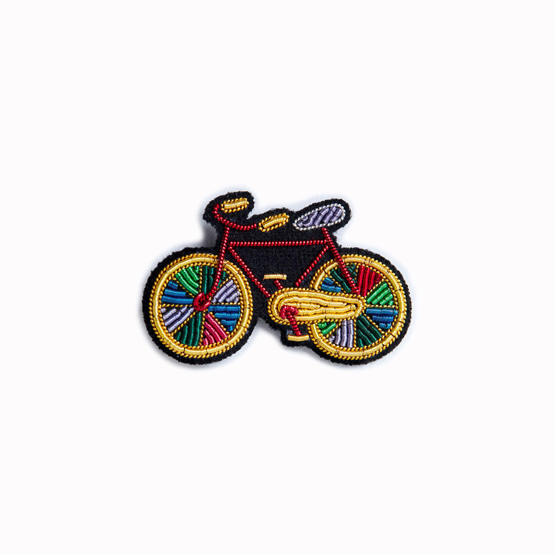 A beautiful hand-embroidered lapel pin for bike lovers everywhere!