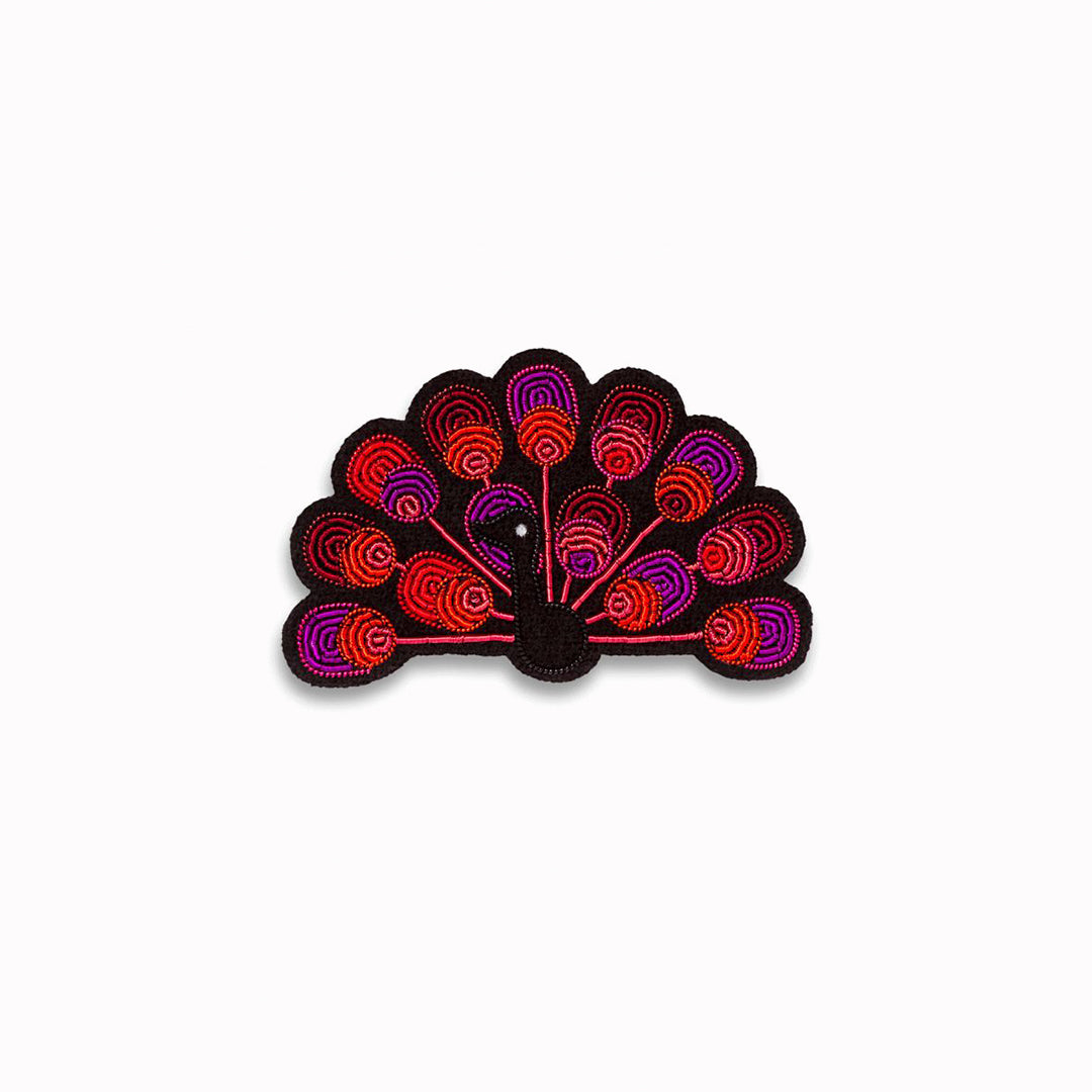 For those who like to strut their stuff, a flamboyant Peacock lapel pin from Macon & Lesquoy, French Hand Embroidered badges and patches using Cannetille thread.