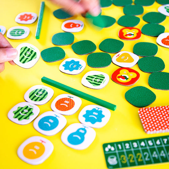 Quickity Pickity Gameplay by Oink Games Japan on yellow table background