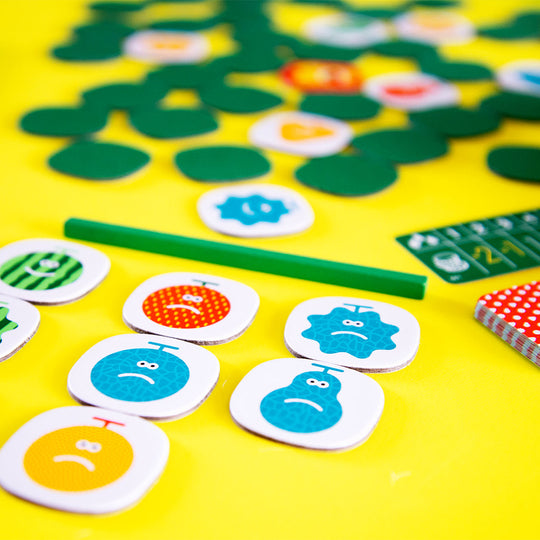 Quickity Pickity Game Tiles by Oink Games Japan on yellow table background