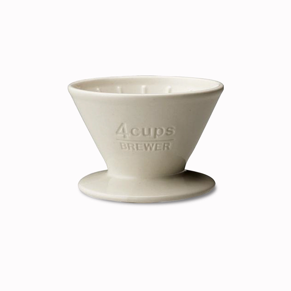 White Porcelain slow coffee 4 cup brew attachment from Kinto Japan,  to be placed above a coffee jug with a filter paper inside.