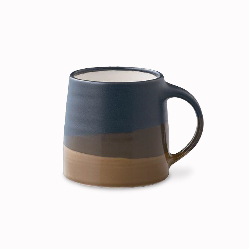A black and Brown chunky porcelain mug from Kinto, to be used as part of your slow coffee ritual. Enjoy a slow, relaxing passage of time and immerse in a deeper, richer, coffee time.