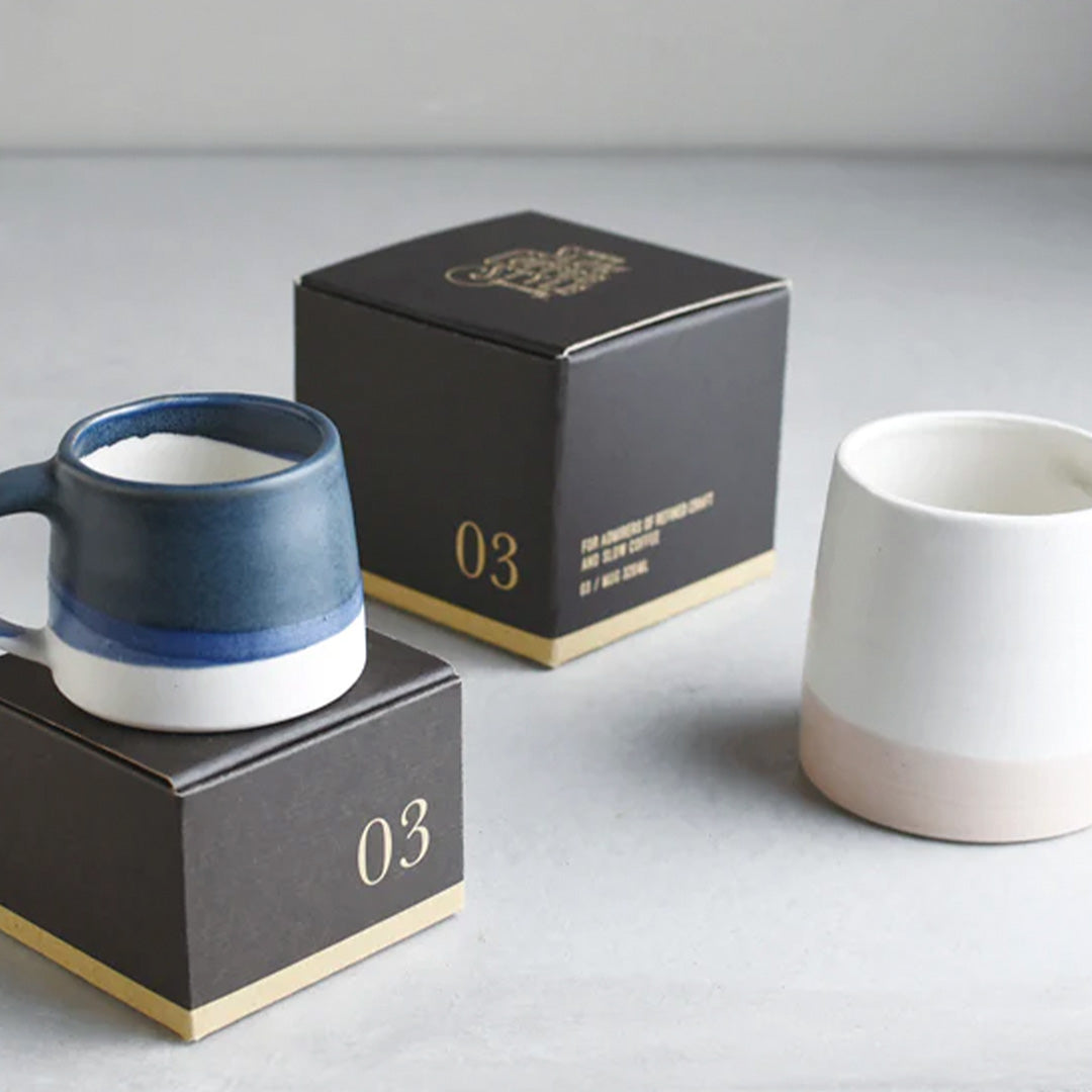 Collection of Slow Coffee Porcelain mugs and boxes from Kinto, as part of your slow coffee ritual. Enjoy a slow, relaxing passage of time and immerse in a deeper, richer, coffee time.