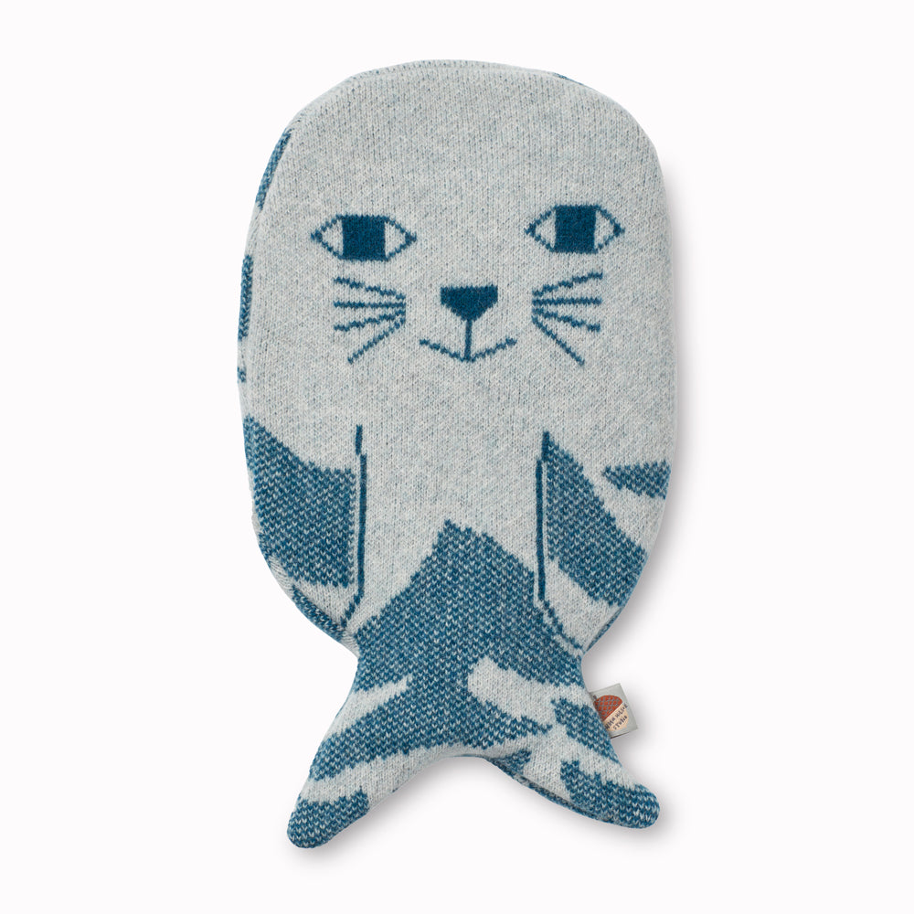 Very cute and cosy Seal hot water bottle with a soft lambswool knitted cover by Donna Wilson, perfect to cuddle up with on a cold evening or to soothe aches and pains.