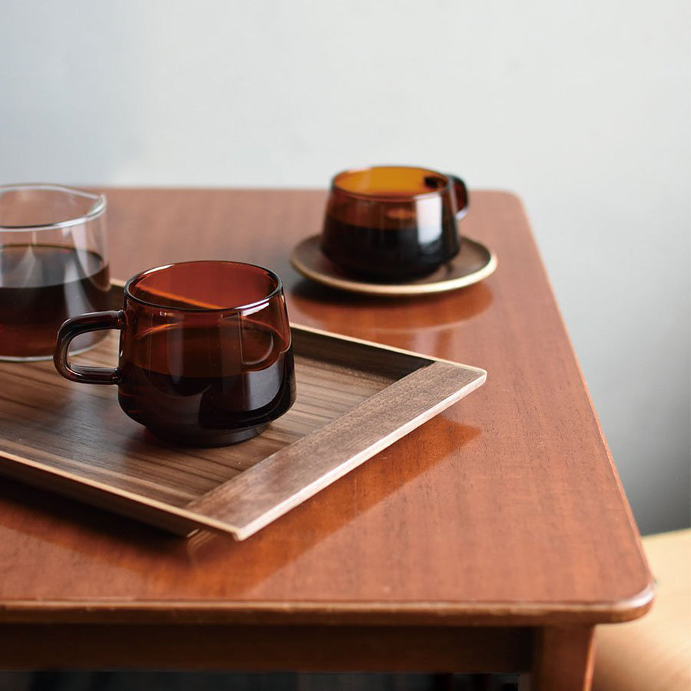 Graceful and nostalgic sepia toned glass cup and mug on table  from Kinto Japan, as part of their Sepia range.