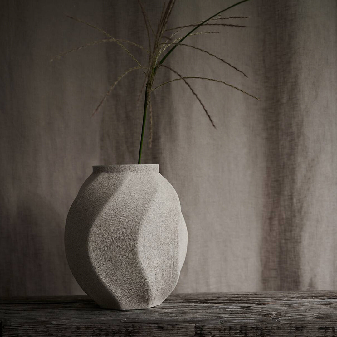 Soft Wave Vase on Table from Swedish design brand Lindform produce ceramics and glassware inspired by the organic tones of Scandinavian nature, while their simple shapes also draw influence from Japanese minimalist styling.