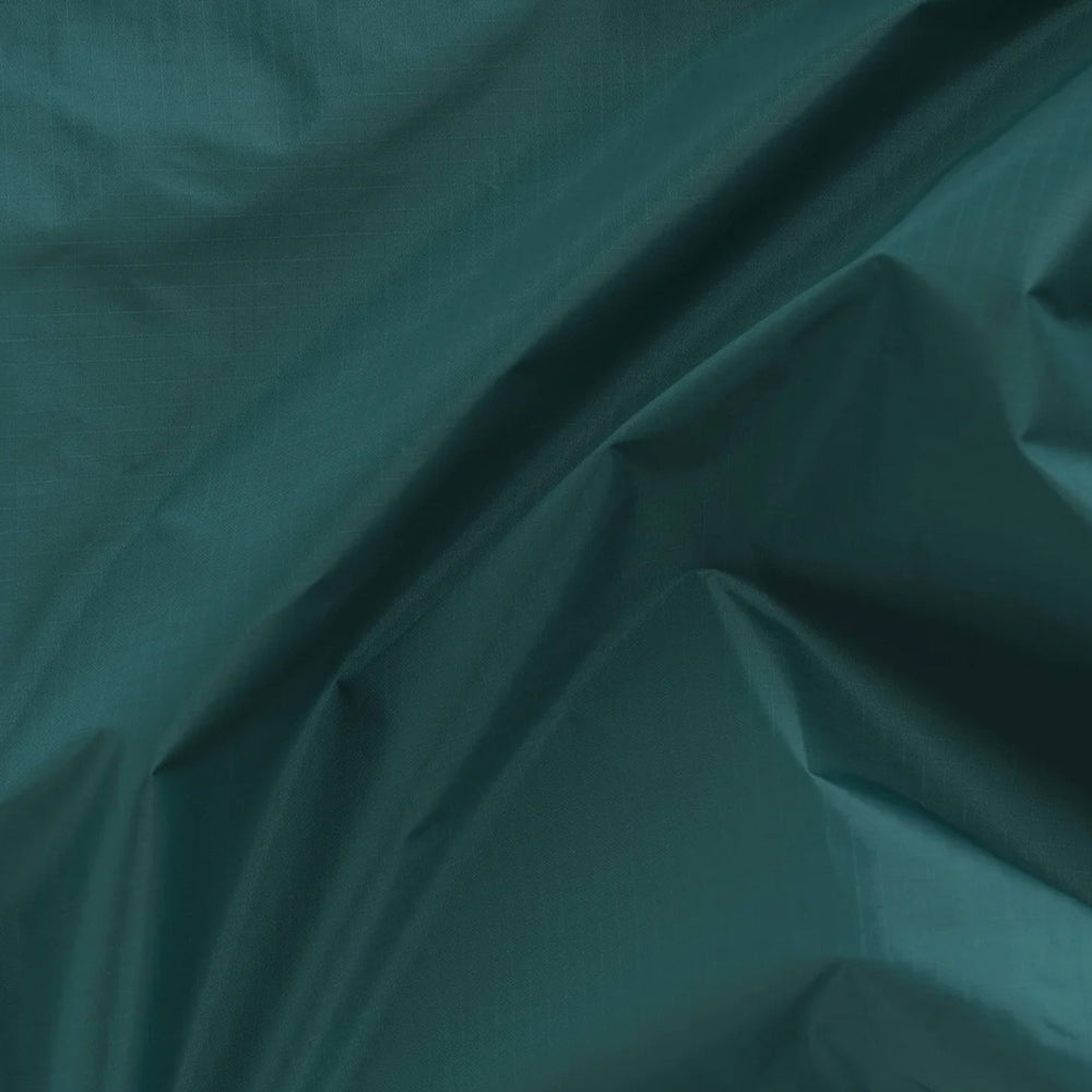 Malachite Reusable shopping bag detail by Californian maker Baggu made from super strong ripstop nylon to transport pretty much anything, so long as it’s under 20kg. It tucks away into a neat little pouch made from its own handle (to minimise waste)