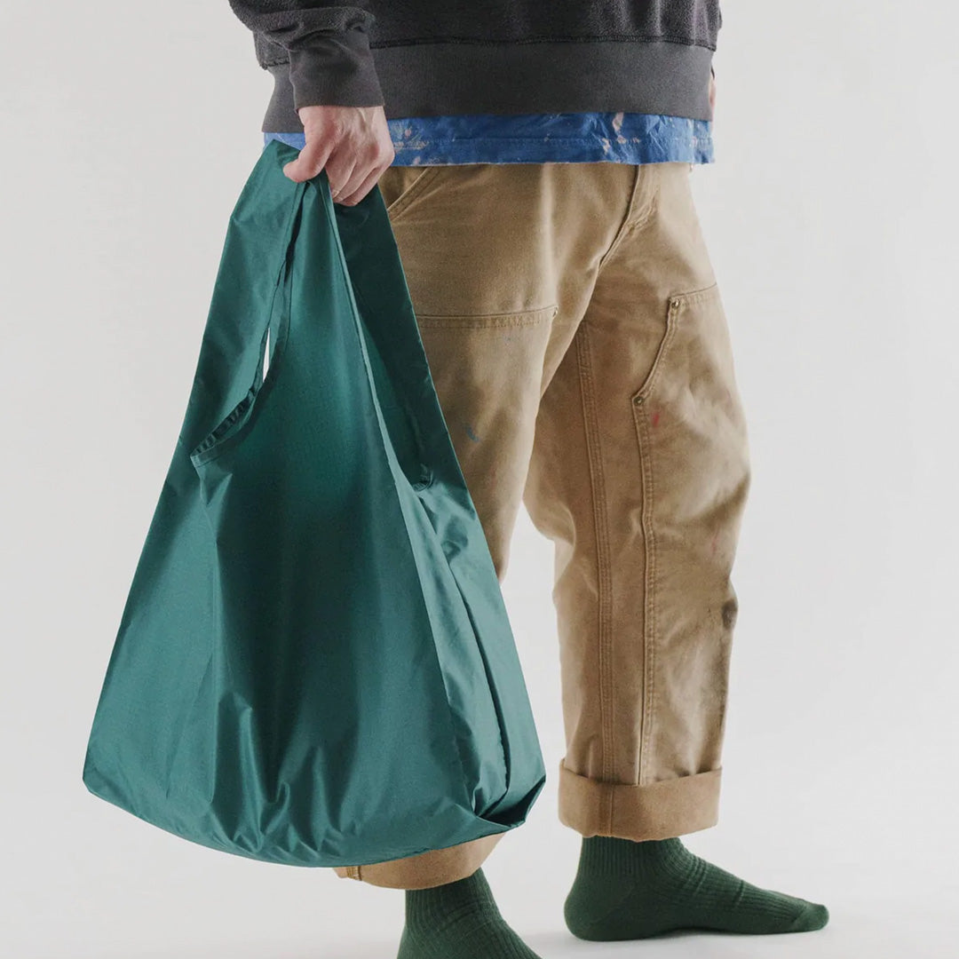 Malachite Reusable shopping bags with model by Californian maker Baggu made from super strong ripstop nylon to transport pretty much anything, so long as it’s under 20kg. It tucks away into a neat little pouch made from its own handle (to minimise waste)