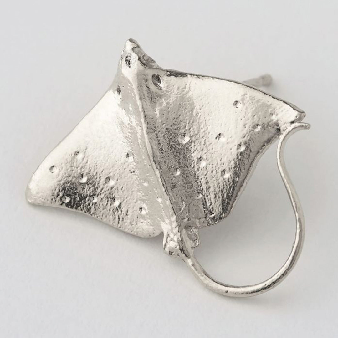 A detail of stud earring by nature inspired London based jewellery maker Alex Monroe.