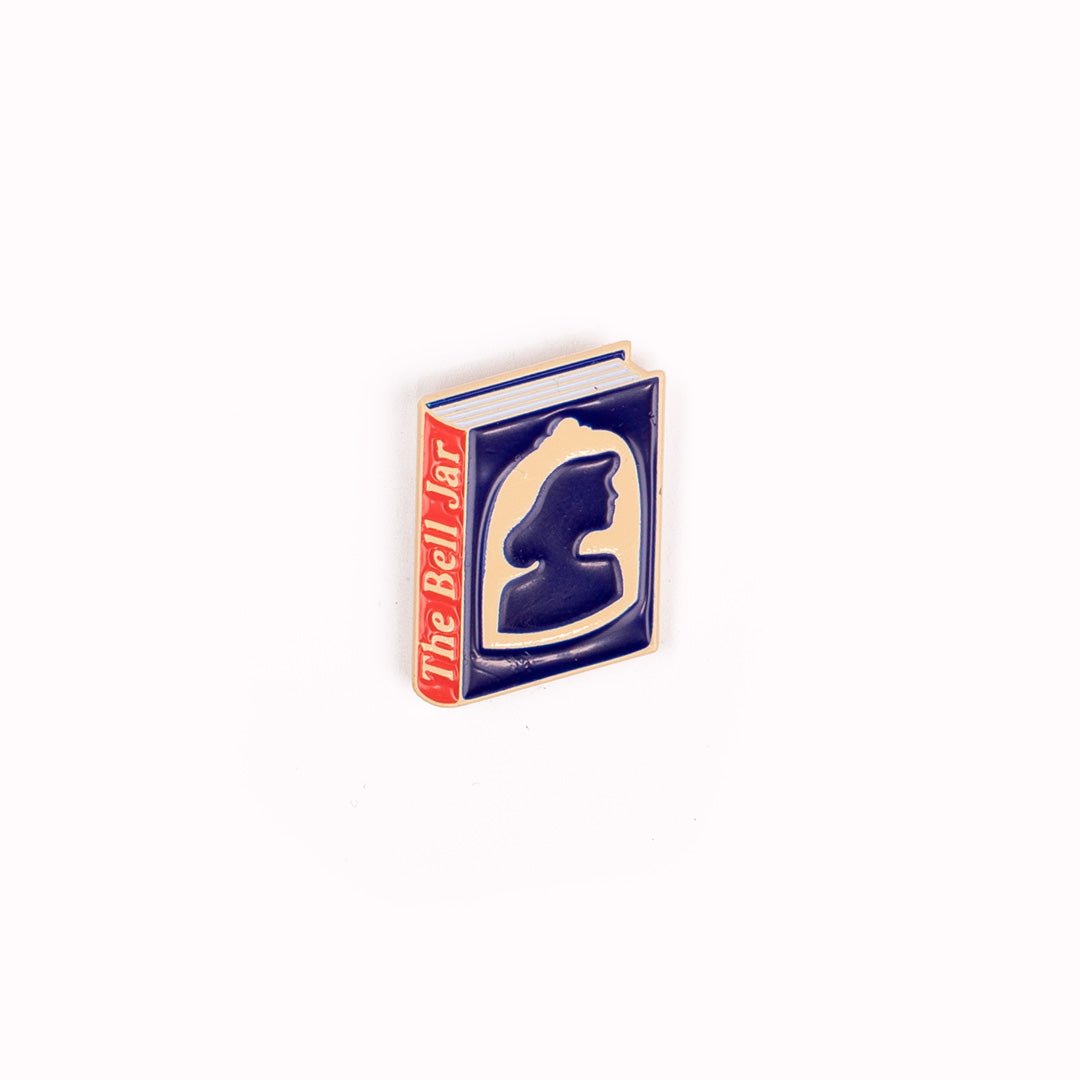 Enamel pin badge featuring an illustrative book cover interpretation of groundbreaking and semi-autobiographical 'The Bell Jar' by American poet Sylvia Plath.