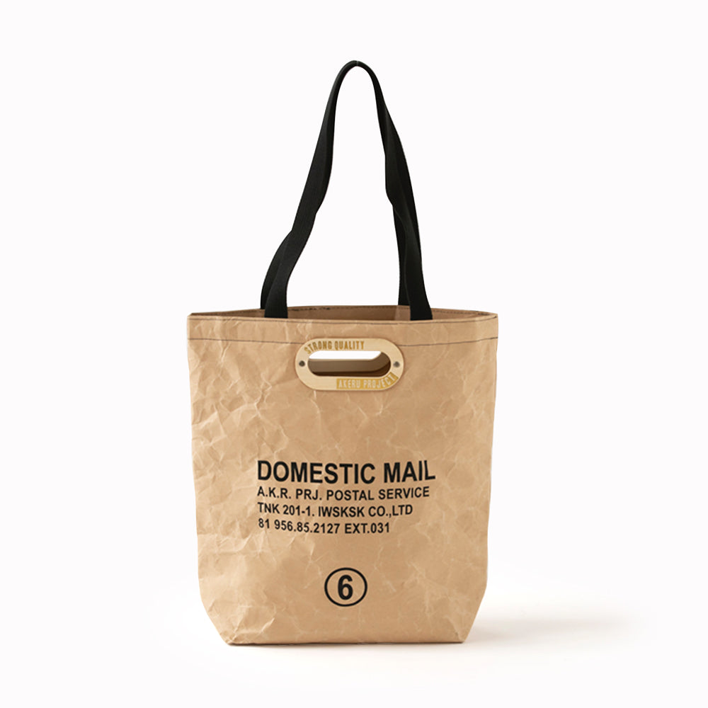 Tote bag no.6 in orange, kraft or khaki, made from strengthened paper that is water resistant, lightweight and durable. It will not tear but softens and creases uniquely with age and wear. Part of the Domestic Mail collection from Japanese producers, Akeru Project.