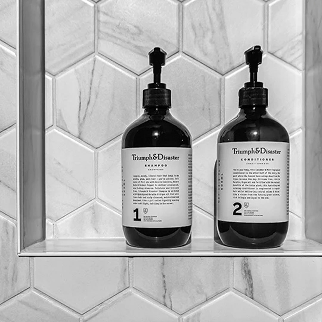 Triumph & Disaster's Acacia and Gypsophila shampoo is a deep cleansing, gentle foaming, 100% naturally derived shampoo. Perfect hair care performance in combination with their No 2 Conditioner.  Lifestyle collection image, shampoo and conditioner.