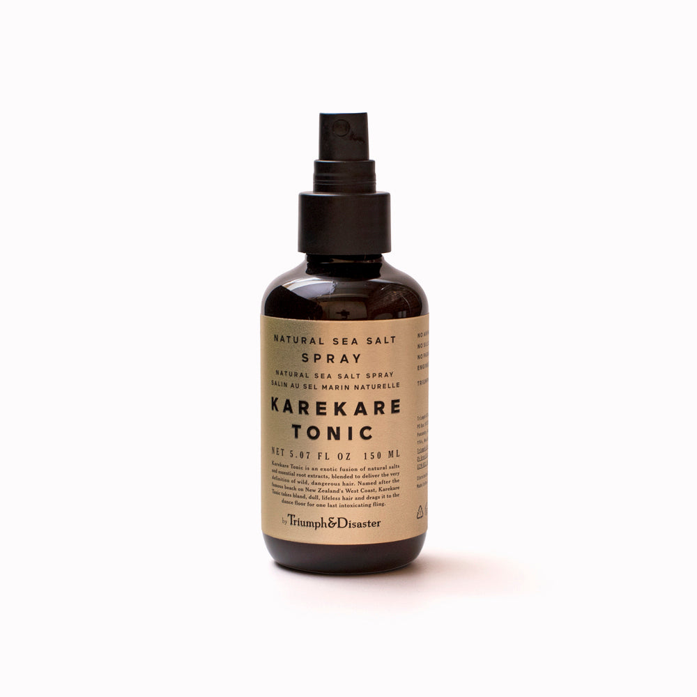 Karekare Hair Tonic is Triumph & Disaster's all natural fusion of sea salt spray and essential root extracts, blended to deliver textured beach hair miles away from the coast. Spray bottle of product.