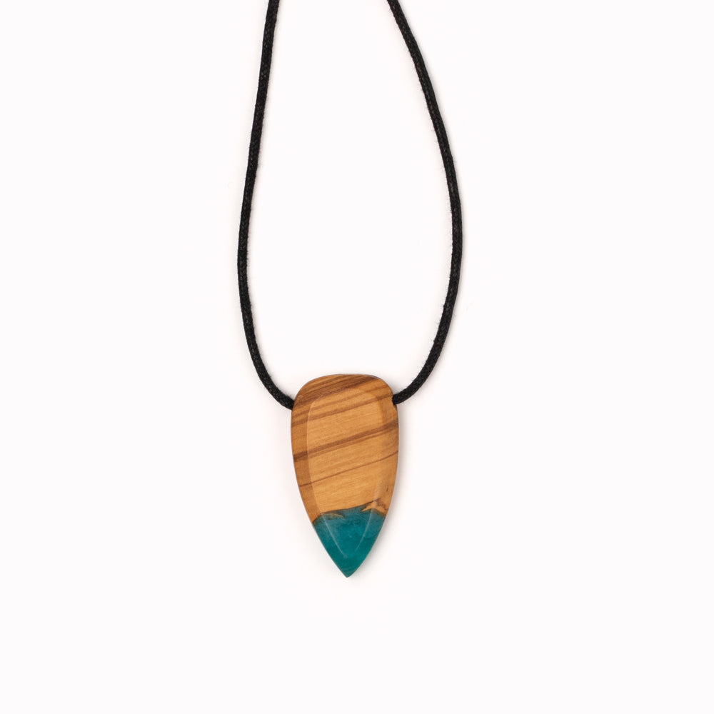 Handmade wood and resin pendant necklaces by Simone Frabboni. These colourful statement tear-drop shaped pendants are made of fine recycled wood and eco-resin.  Simone Frabboni is an Italian contemporary jewellery maker and skateboarder. Her limited edition collections support reforestation and sustainable fashion.