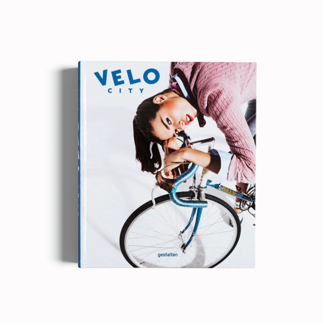 Velo-City, Bicycle Culture and City Life Book, Cover. Woman on bicycle. As one of the the most sustainable, healthy, and economical means of transportation in today's cities, the bicycle has the power to change our future profoundly. Time to explore that future – come take a breath of fresh air with VELO City. 