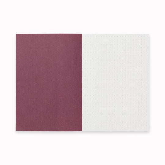 Inside Cover of Notem Vita Medium Notebook showing dotted page. This notebook is a stylish and functional notebook that helps you organize your thoughts and ideas.