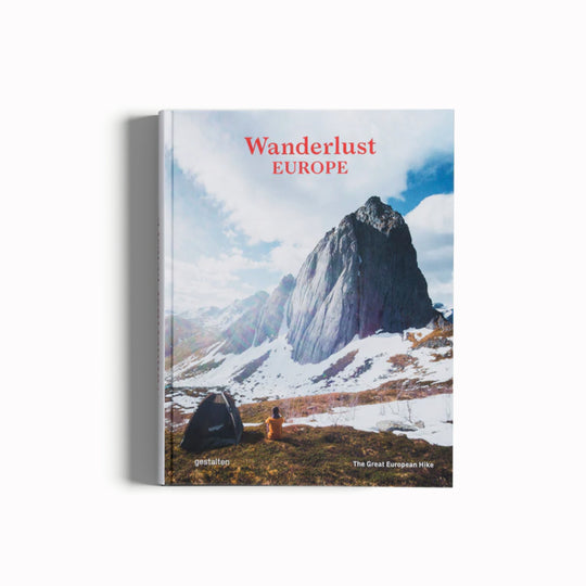 Wanderlust Europe- The Great European Hike, cover. Camping in the snowy mountains. Wanderlust Europe points the reader in the direction of the continent’s most awe-inspiring routes. Offering expert knowledge on how best to experience the wild outdoors, this stimulating manual traverses far-reaching locales in pursuit of breath-taking beauty and a sense of freedom.