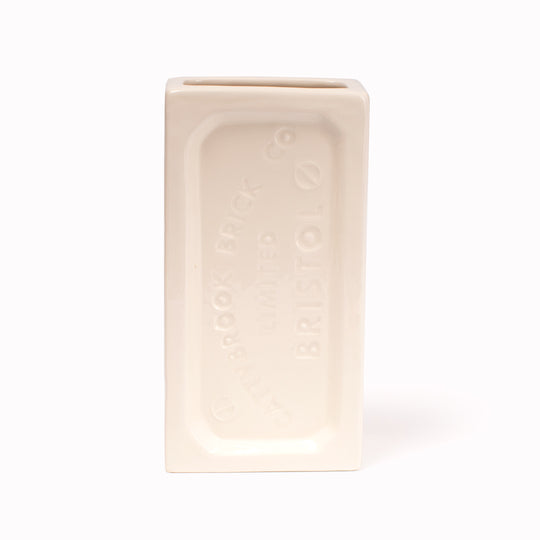 A ceramic vase in the shape of the classic Bristol Brick. Made by StolenForm, a concept brand that specialises in repurposing industrialised objects, transforming them into home accessories and giftware products. The Bristol bricks are watertight, perfect for flowers and plants, or can be used for office stationery or kitchen utensils. This colourway is White.