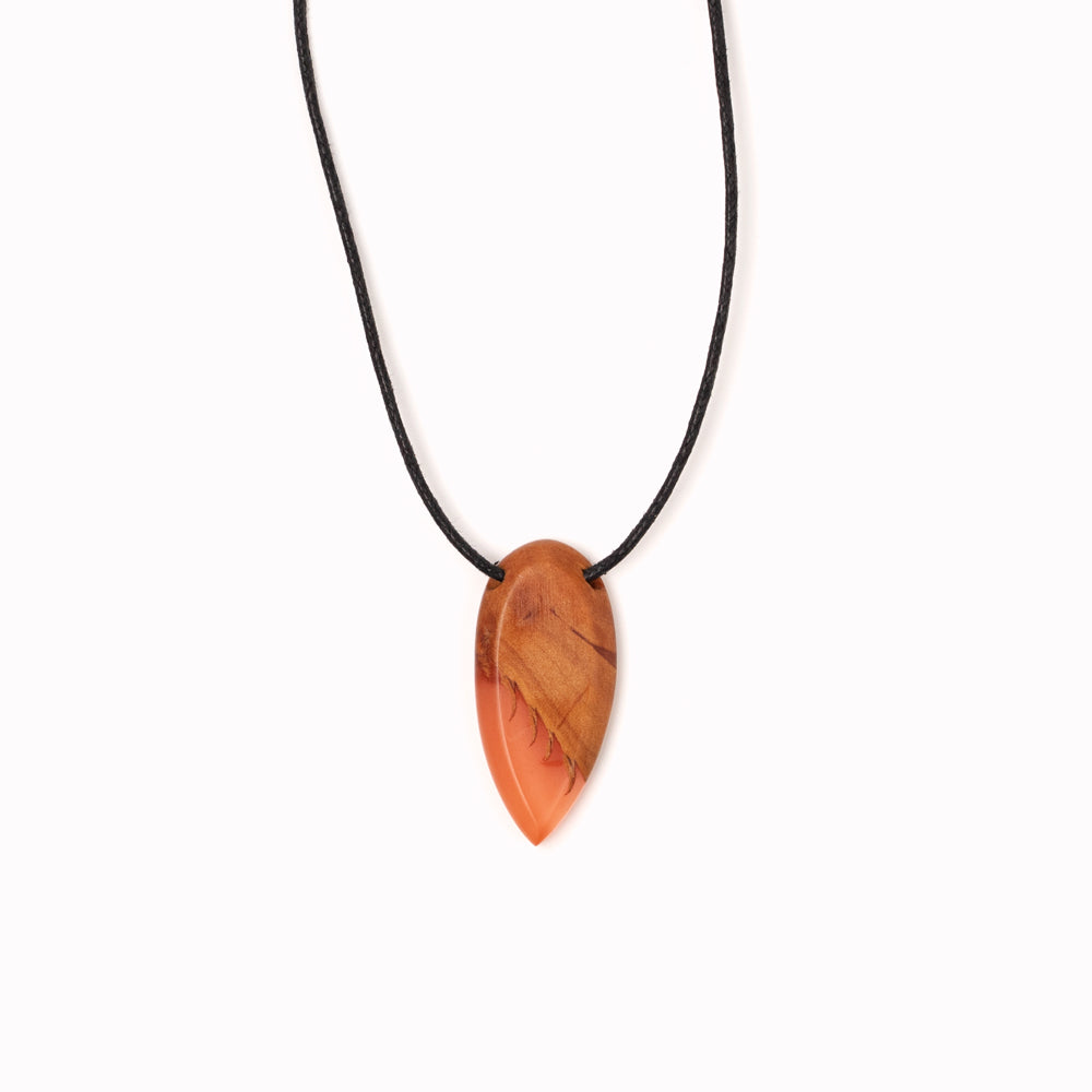 Handmade wood and resin pendant necklaces by Simone Frabboni. These colourful statement tear-drop shaped pendants are made of fine recycled wood and eco-resin.  Simone Frabboni is an Italian contemporary jewellery maker and skateboarder. Her limited edition collections support reforestation and sustainable fashion.