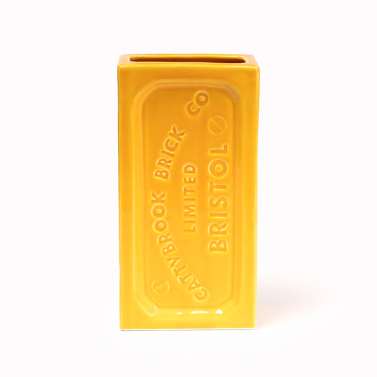 A ceramic vase in the shape of the classic Bristol Brick. Made by StolenForm, a concept brand that specialises in repurposing industrialised objects, transforming them into home accessories and giftware products. The Bristol bricks are watertight, perfect for flowers and plants, or can be used for office stationery or kitchen utensils. This colourway is Yellow.