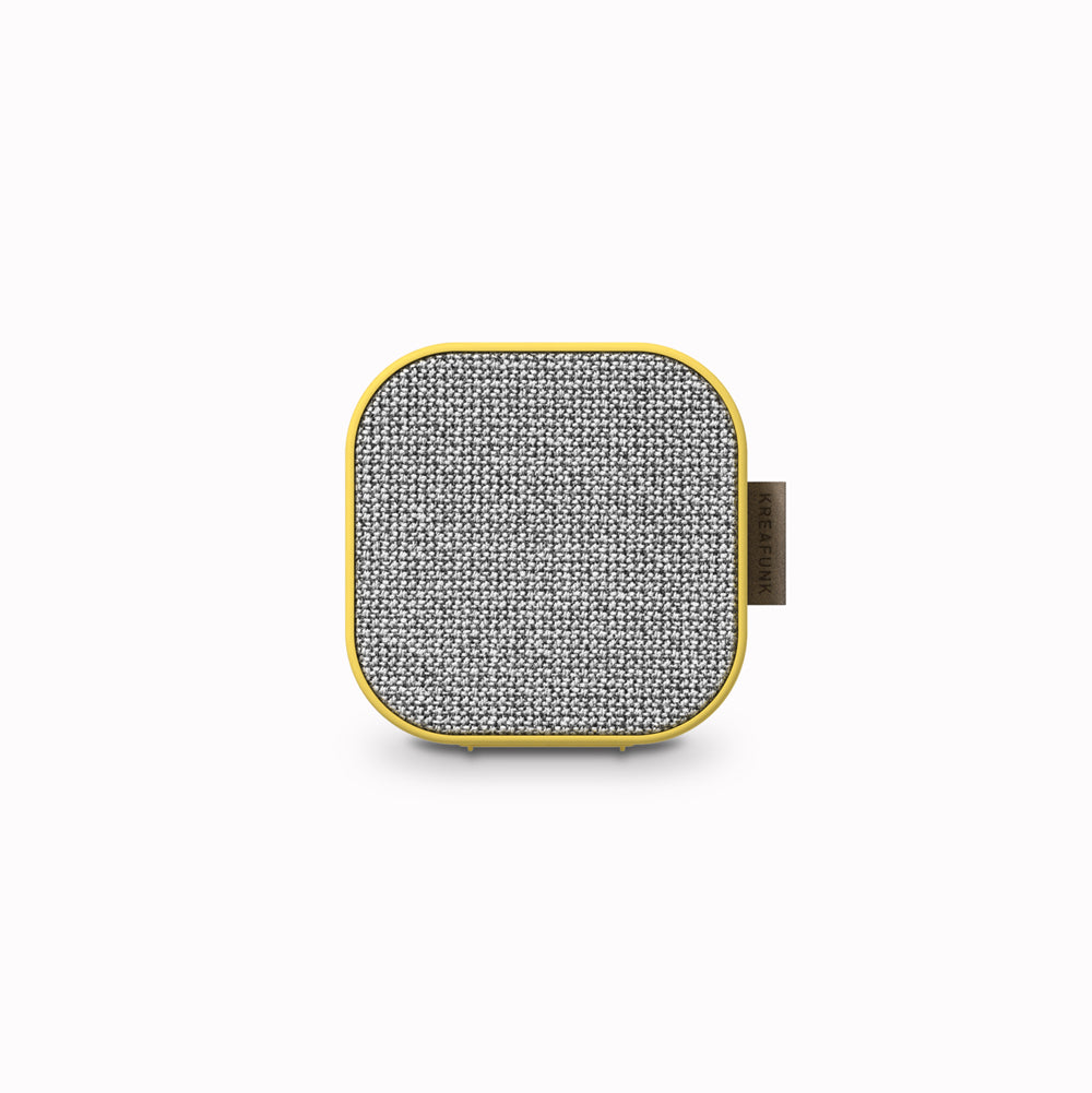 The yellow aCUBE is a small and stylish portable bluetooth speaker by Kreafunk, designed for the small studio apartment as well as for the bathroom, living room or kitchen or hotel or apartment when travelling. 
