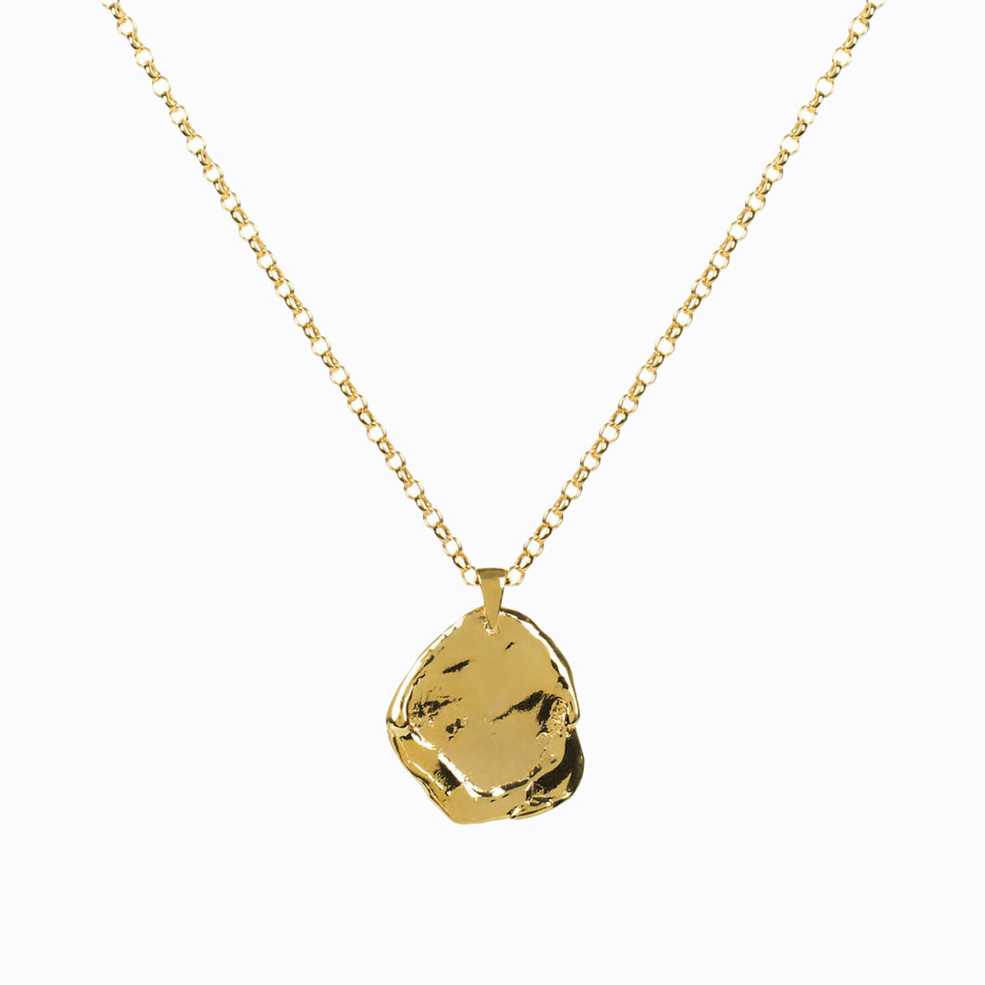 Hand carved Antigua gold vermeil textured pendant on a 55cm chain by Matthew Calvin. Reminiscent of antique and molten coins, it's perfect for layering and a classic staple piece of jewellery either stacked or worn alone.