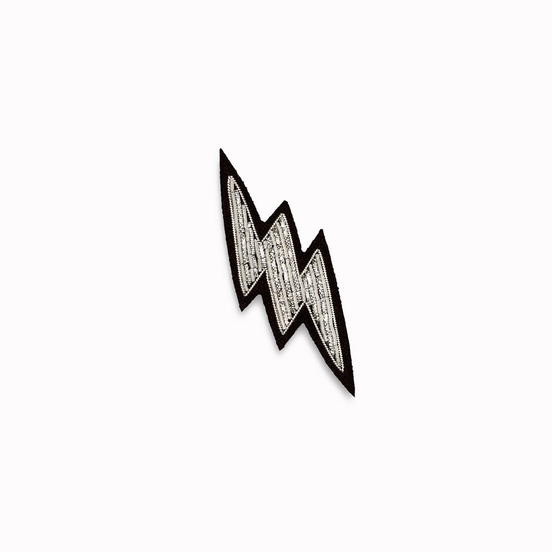 Make a statement with this beautiful silver lightning bolt hand embroidered decorative lapel pin by Paris based Macon et Lesquoy