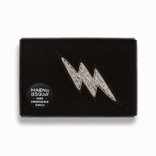 Make a statement with this beautiful silver lightning bolt hand embroidered decorative lapel pin in box by Paris based Macon et Lesquoy