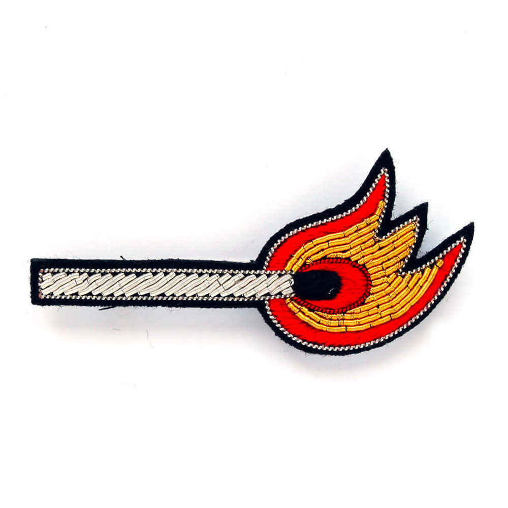 Like a match to a flame... hand embroidered lapel badge, From Macon & Lesquoy, French Hand Embroidered badges and patches using Cannetille thread.