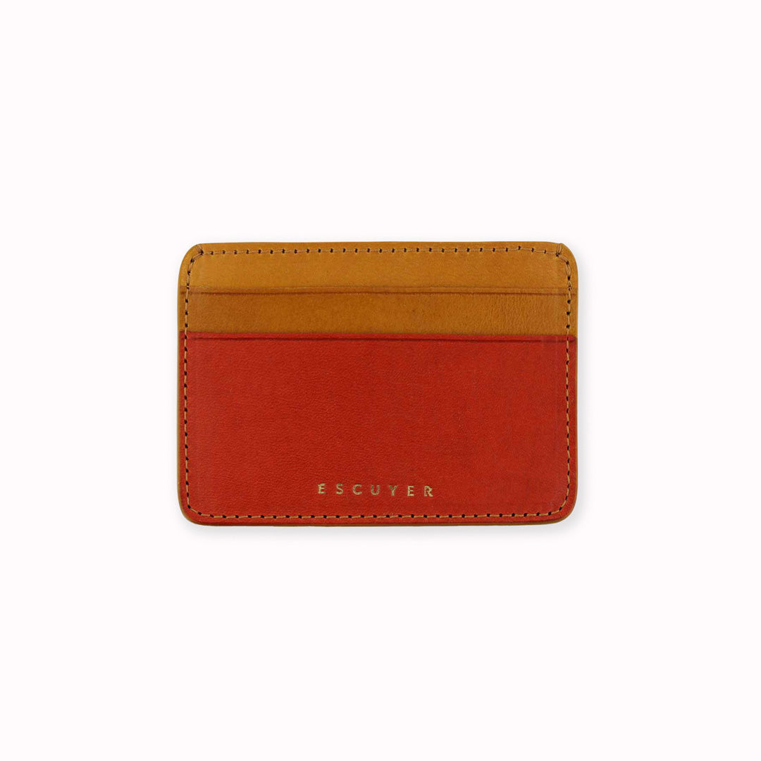 Elegant leather cardholder from Escuyer, featuring orange and mustard vegetable dyed colour tones for a stylish and bright appearance. Handmade by Portuguese artisans using leather from a tannery in Tuscany, Italy.