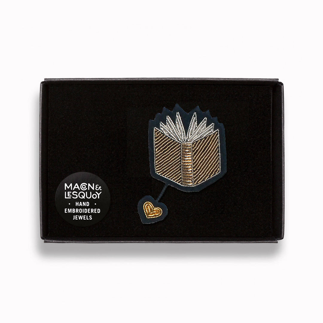 Open Book hand embroidered decorative lapel pin in a presentation box From Macon & Lesquoy, French Hand Embroidered badges and patches using Cannetille thread.
