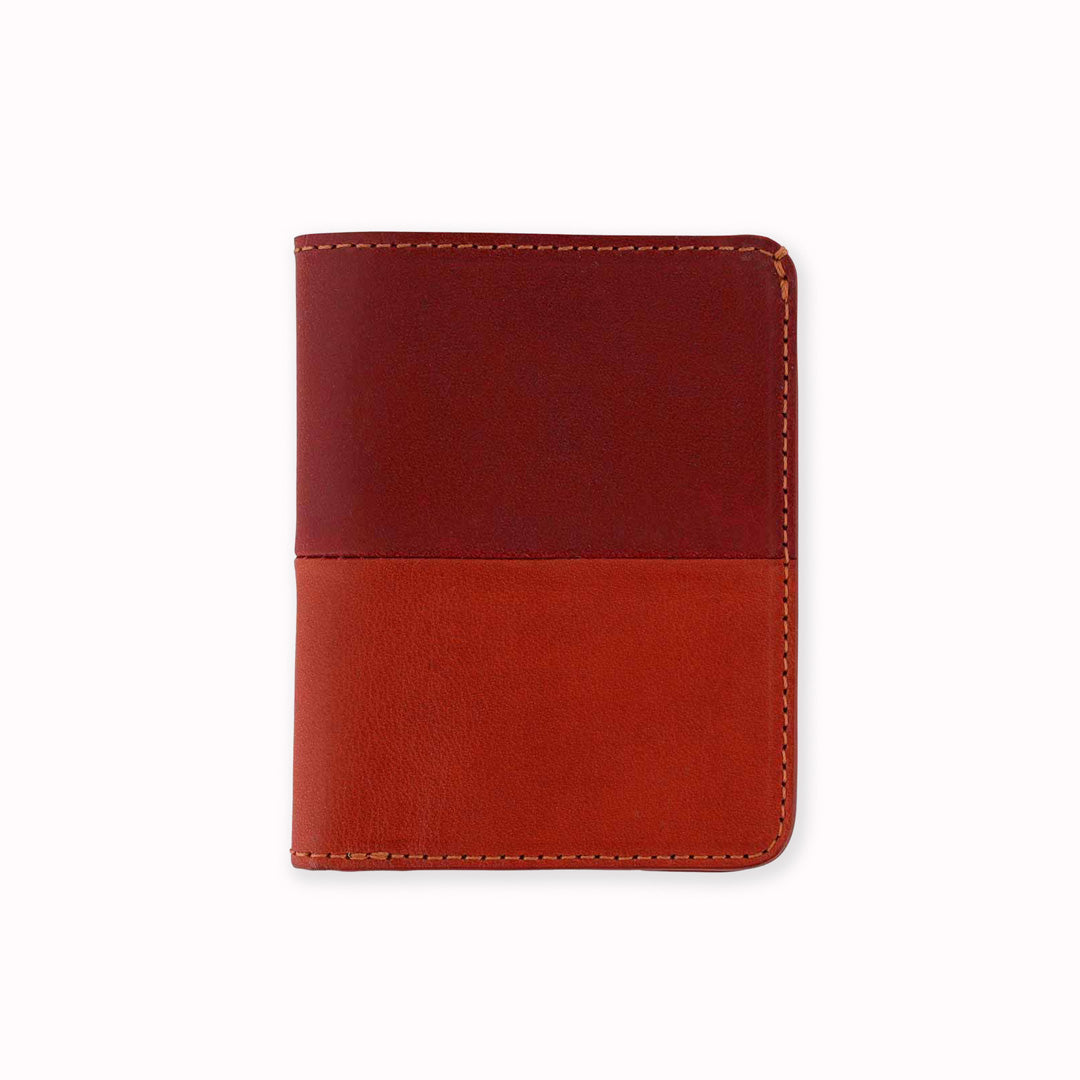 Slim Italian leather wallet from Escuyer, featuring bright red and orange vegetable dyed colour tones for a subtle and stylish appearance - half and half on the outside, orange on the inside. Handmade by Portuguese artisans using leather from a tannery in Tuscany